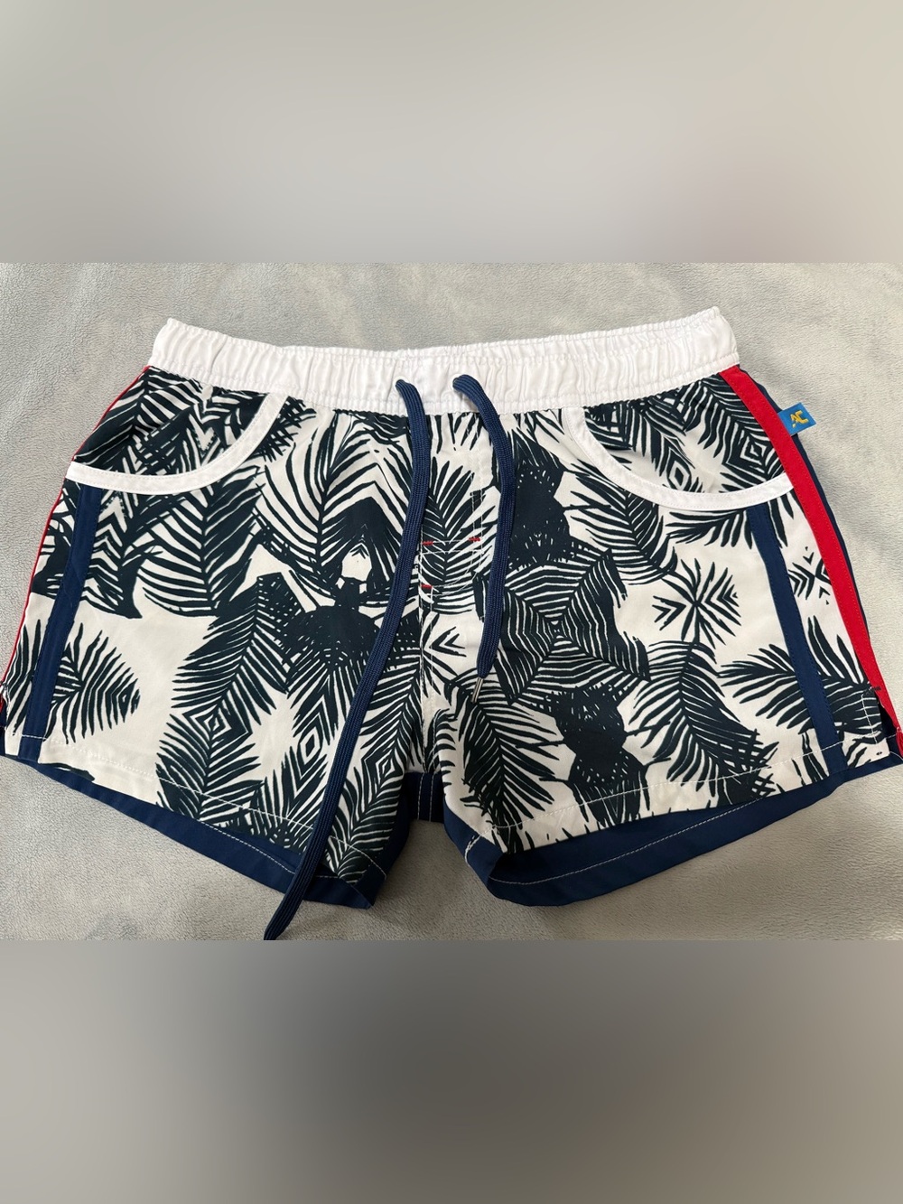 Andrew Christian lined swim trunks. They are a men’s large.